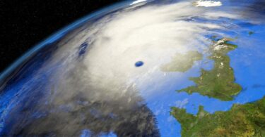 Satellite view of a storm system over the UK, symbolising extreme weather risks.