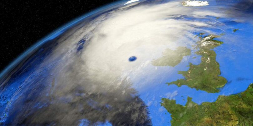 Satellite view of a storm system over the UK, symbolising extreme weather risks.