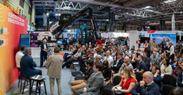 Delegates and exhibitors at Environmental Services & Solutions Expo 2025 discussing climate and sustainability innovations