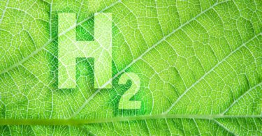 “Green hydrogen symbol H₂ overlayed on a leaf texture representing renewable fuels certification and sustainability.”