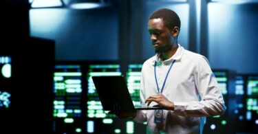 Engineers inspecting data centre servers symbolising Kent’s global digital infrastructure expertise.