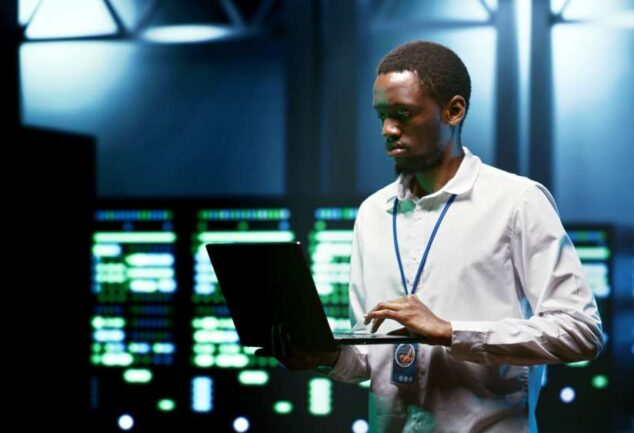 Engineers inspecting data centre servers symbolising Kent’s global digital infrastructure expertise.