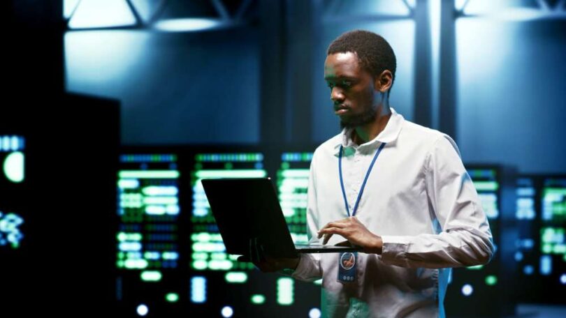 Engineers inspecting data centre servers symbolising Kent’s global digital infrastructure expertise.