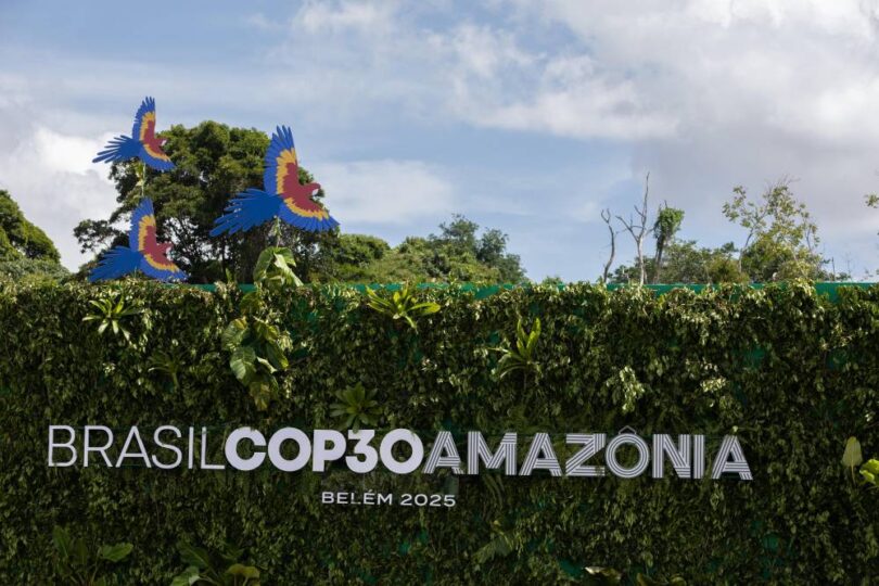 COP30 Amazônia sign surrounded by greenery and tropical foliage in Belém, Brazil, representing global climate and biodiversity action.