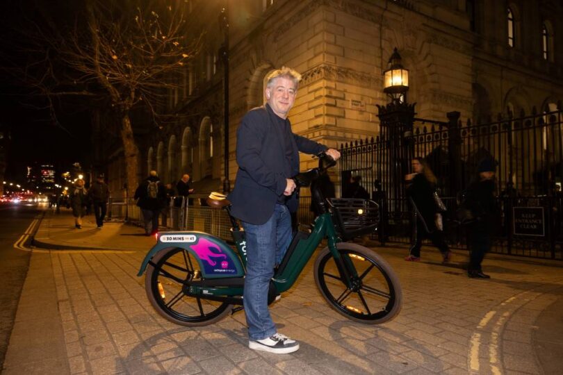 Greg Jackson, Founder and CEO of Octopus Energy, standing with a Forest electric bike outside Number 11 Downing Street in London