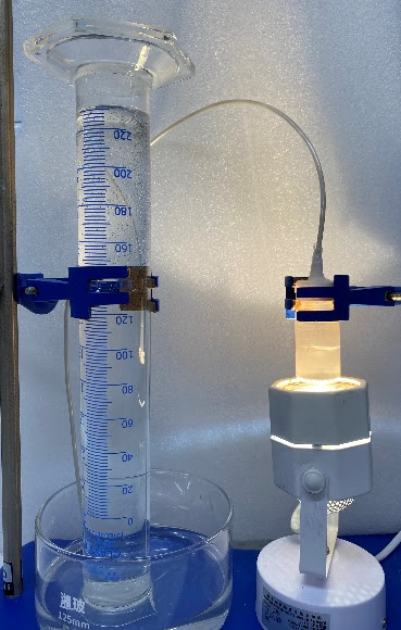 Laboratory setup demonstrating sunlight-driven hydrogen production using liquid gallium and water
