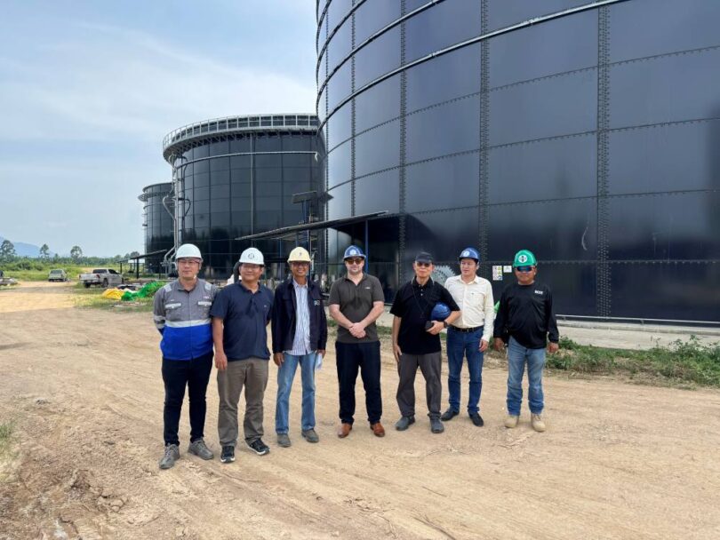 biogas digester tanks at palm oil waste treatment facility in Thailand