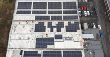 rooftop solar panels installed on industrial building in Glasgow