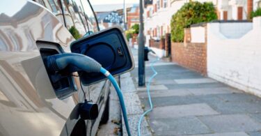 electric vehicle charging on residential street in London showing EV adoption growth in England
