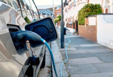 electric vehicle charging on residential street in London showing EV adoption growth in England