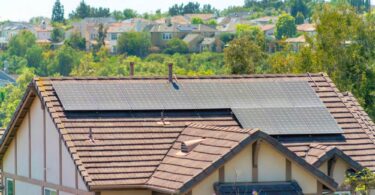 UK home with rooftop solar panels generating renewable energy