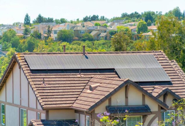 UK home with rooftop solar panels generating renewable energy