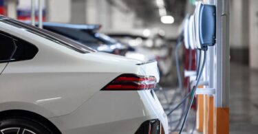 Electric vehicle charging at EV charging station during transition to zero emission transport