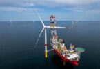 Ocean Winds EMYN offshore wind farm turbine installation vessel at sea with completed wind turbines France