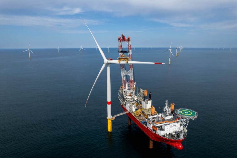 Ocean Winds EMYN offshore wind farm turbine installation vessel at sea with completed wind turbines France