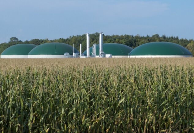 anaerobic digestion renewable natural gas facility beside agricultural crops
