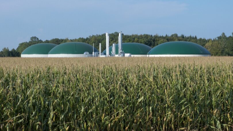 anaerobic digestion renewable natural gas facility beside agricultural crops