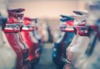 electric vehicle fleet cars parked dealership transport infrastructure