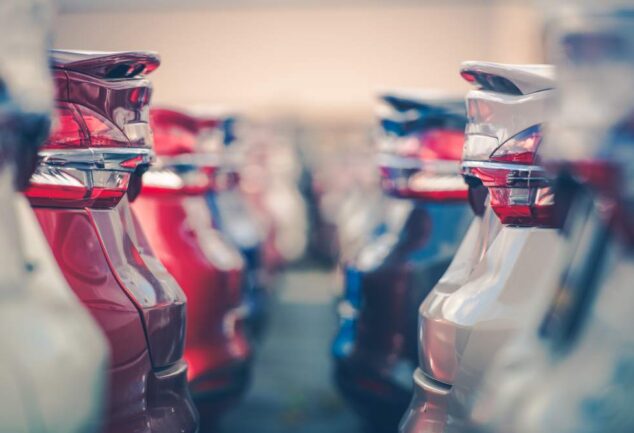electric vehicle fleet cars parked dealership transport infrastructure