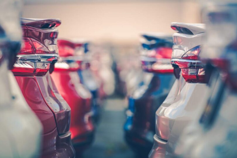 electric vehicle fleet cars parked dealership transport infrastructure