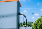 electric vehicle charging station with battery storage infrastructure outdoors
