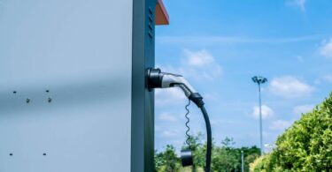 electric vehicle charging station with battery storage infrastructure outdoors