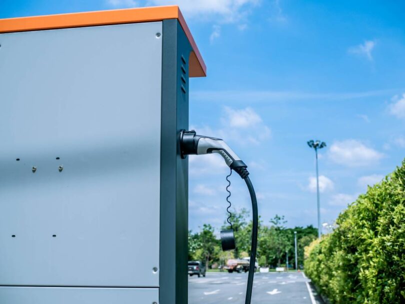 electric vehicle charging station with battery storage infrastructure outdoors