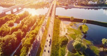 Aerial view of rivers, wetlands and transport infrastructure illustrating climate resilience and environmental risk management.