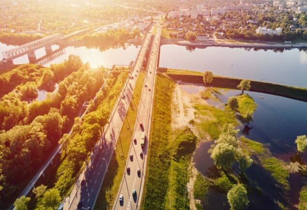 Aerial view of rivers, wetlands and transport infrastructure illustrating climate resilience and environmental risk management.