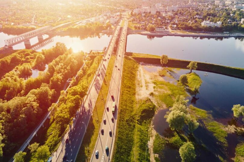 Aerial view of rivers, wetlands and transport infrastructure illustrating climate resilience and environmental risk management.
