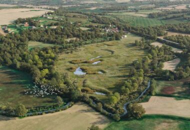 Aerial view of the 17-hectare Ashurst biodiversity net gain site in Kent, where Wates Wildscape and Cura Terrae are creating grasslands, woodlands, ponds and wetland habitats.