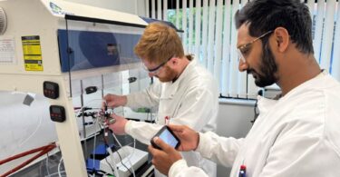 Researchers checking ammonia levels in a Rhizo PTX electrolyser using laboratory analysis equipment