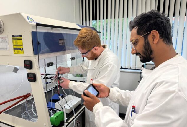 Researchers checking ammonia levels in a Rhizo PTX electrolyser using laboratory analysis equipment