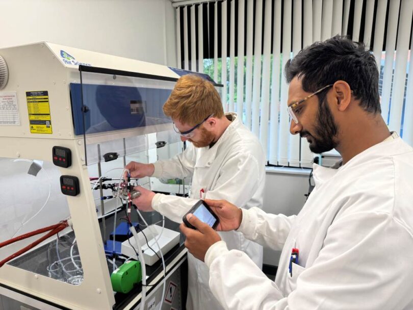 Researchers checking ammonia levels in a Rhizo PTX electrolyser using laboratory analysis equipment