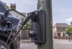 Electric vehicle charging from a lamp column charger on a residential street