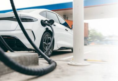 Electric vehicle charging at a public fast-charging station in Europe.