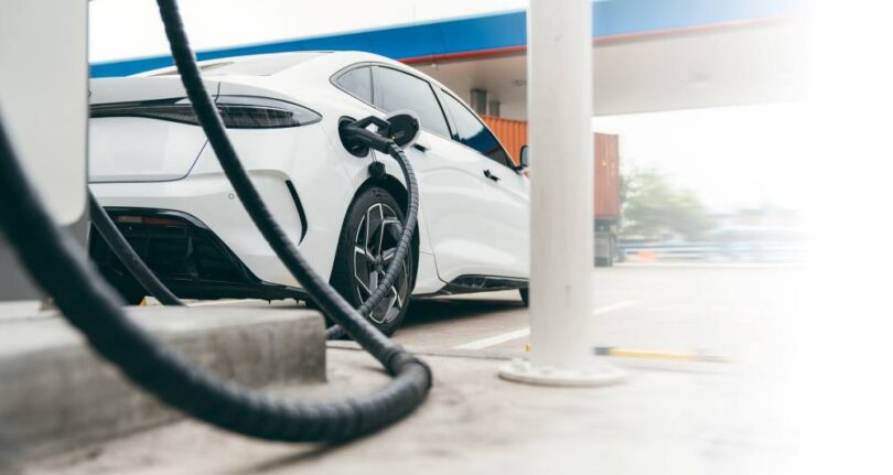 Electric vehicle charging at a public fast-charging station in Europe.