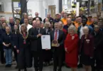 ERG Chairman James Scott-Bowden and CEO Richard Hanson receive The King's Award for Enterprise alongside employees and guests.