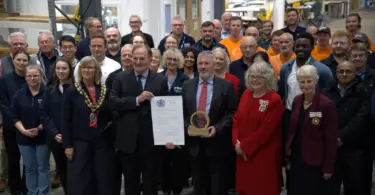 ERG Chairman James Scott-Bowden and CEO Richard Hanson receive The King's Award for Enterprise alongside employees and guests.
