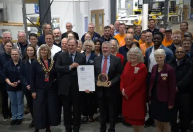 ERG Chairman James Scott-Bowden and CEO Richard Hanson receive The King's Award for Enterprise alongside employees and guests.