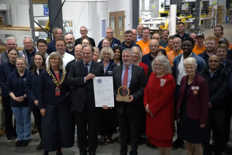 ERG Chairman James Scott-Bowden and CEO Richard Hanson receive The King's Award for Enterprise alongside employees and guests.