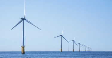 Wind turbines in an offshore wind farm in the North Sea off the Dutch coast on a clear day.