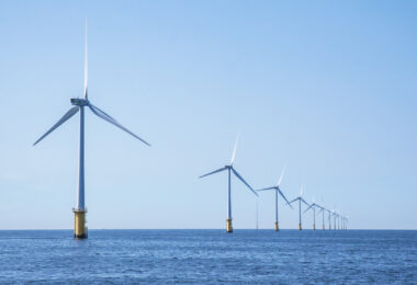 Wind turbines in an offshore wind farm in the North Sea off the Dutch coast on a clear day.