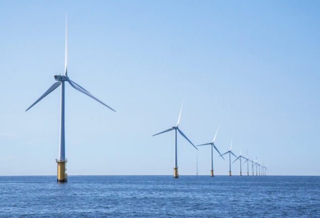 Wind turbines in an offshore wind farm in the North Sea off the Dutch coast on a clear day.
