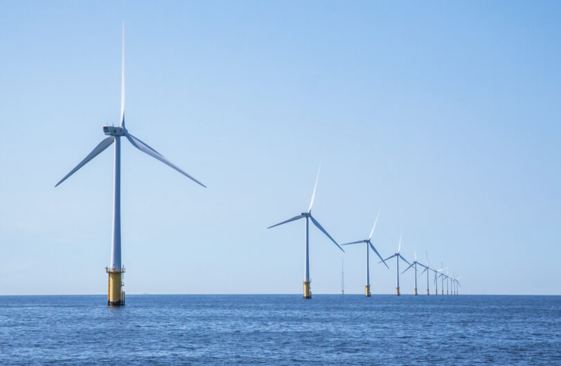 Wind turbines in an offshore wind farm in the North Sea off the Dutch coast on a clear day.